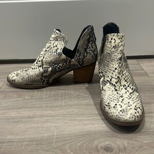 Faux black and cream snake booties. Normal wear.